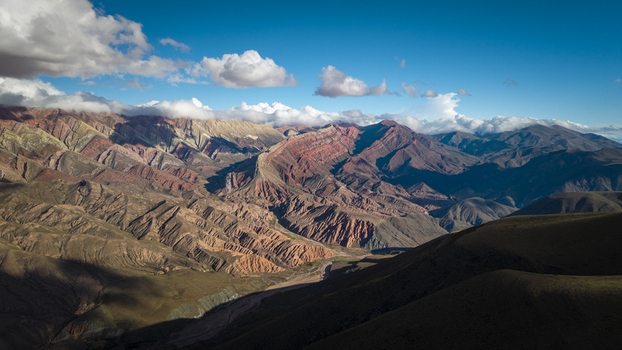 Aerial view of the colorful sedimentary rock formations of the Hornocal mountain range under a bright blue sky in Humahuaca Jujuy Province Argentina. Aerial view of the colorful sedimentary rock formations of the Hornocal mountain range under a bright blue sky in Humahuaca Jujuy Province Argentina.