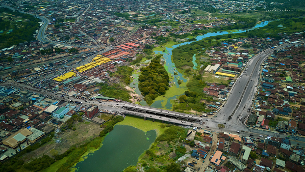 Aerial view of the vibrant city with its market stalls the bridge crossing the river and the lush greenery interweaving with the urban sprawl Abeokuta Ogun State Nigeria.
