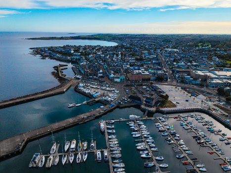 Aerial view of Bangor Harbour and Town with numerous boats docked in the marina historic buildings and coastal scenery in Bangor Northern Ireland United Kingdom.