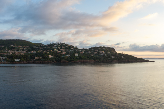 Aerial view of the coastal landscape of Le Trayas featuring Mediterranean waters rocky cliffs and hillside villas at sunrise in Saint Raphael Provence Alpes Cote d Azur France. Aerial view of the coastal landscape of Le Trayas featuring Mediterranean waters rocky cliffs and hillside villas at sunrise in Saint Raphael Provence Alpes Cote d Azur France.