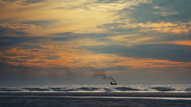 View of a fishing boat at sunset Bangladesh. View of a fishing boat at sunset Bangladesh.