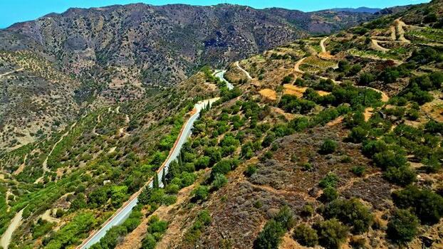 Aerial view of winding mountain road in Crete Greece.