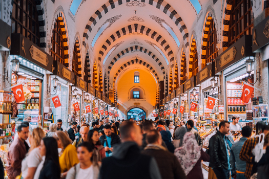 Istanbul Turkiye 05 October 2019 View of the bustling Grand Bazaar a vibrant tapestry of colors and textures under its ornate arched ceiling alive with the energy of shoppers and vendors.