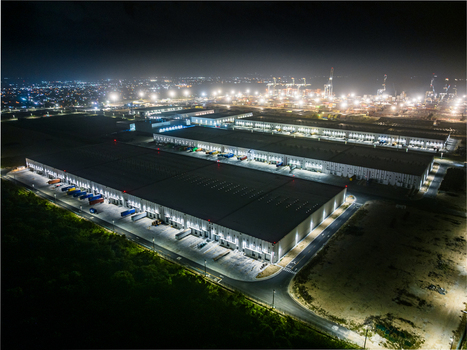 Aerial view of the illuminated Caucedo Logistics Center at night featuring large warehouse facilities and shipping containers in Andres Santo Domingo Dominican Republic. Aerial view of the illuminated Caucedo Logistics Center at night featuring large warehouse facilities and shipping containers in Andres Santo Domingo Dominican Republic.