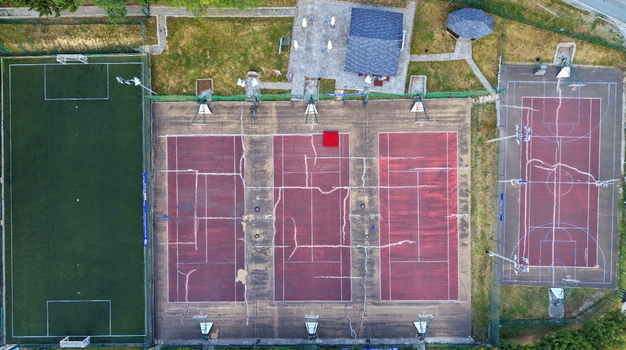 Aerial view of the Brzece Sports Center featuring multiple tennis courts a soccer field and a basketball court Brzece Rasina District Serbia.