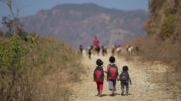 View of children walking on a rural road in Surkhet Nepal.