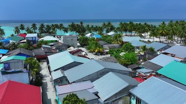 Aerial view of colorful rooftops and palm trees Maldives. Aerial view of colorful rooftops and palm trees Maldives.