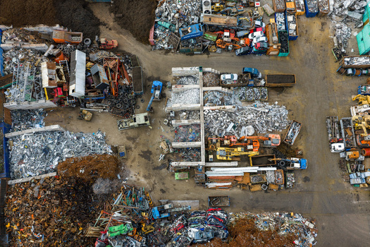 Aerial view of scrapped cars and crushed metal debris piled in a junkyard and recycling site in Hoogeveen Drenthe Netherlands. Aerial view of scrapped cars and crushed metal debris piled in a junkyard and recycling site in Hoogeveen Drenthe Netherlands.