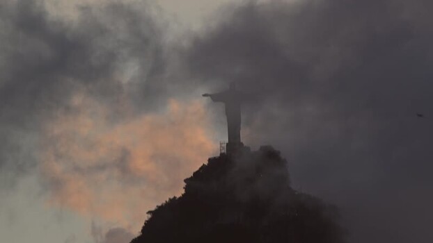 View of Christ the Redeemer statue shrouded in clouds Brazil.