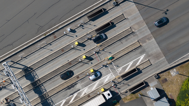 Aerial view of the Gare de Peage de Dury toll station with vehicles passing through lanes in Saleux Hauts de France France.