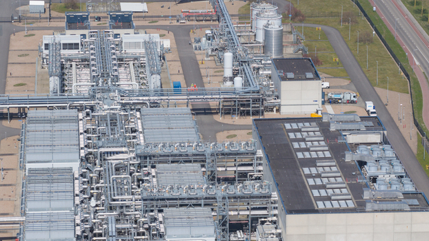 Aerial view of the Boekelermeer industrial facility with complex piping systems storage tanks and modern infrastructure in Alkmaar Noord Holland Netherlands. Aerial view of the Boekelermeer industrial facility with complex piping systems storage tanks and modern infrastructure in Alkmaar Noord Holland Netherlands.