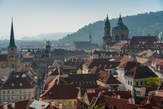 View of the historic rooftops and the iconic dome of St. Nicholas Church in the old town of Prague Prague Czechia.