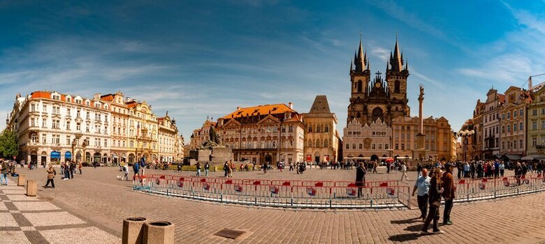 Prague Czechia 08 May 2023 View of the historic Old Town Square featuring the iconic Church of Our Lady before Tyn surrounded by colorful buildings under a clear blue sky. Prague Czechia 08 May 2023 View of the historic Old Town Square featuring the iconic Church of Our Lady before Tyn surrounded by colorful buildings under a clear blue sky.