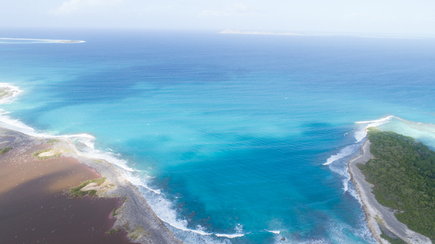 Aerial view of Los Roques archipelago featuring turquoise waters coral reefs and sandy coastlines Los Roques Dependencias Federales Venezuela. Aerial view of Los Roques archipelago featuring turquoise waters coral reefs and sandy coastlines Los Roques Dependencias Federales Venezuela.