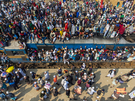 Tongi Bangladesh 04 February 2024 Aerial view of Tongi Junction railway station with a crowded train and people on the platform during the Biswa Ijtema festival. Tongi Bangladesh 04 February 2024 Aerial view of Tongi Junction railway station with a crowded train and people on the platform during the Biswa Ijtema festival.