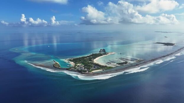 Aerial view of a resort with turquoise lagoon and reef Thulusdhoo Maldives. Aerial view of a resort with turquoise lagoon and reef Thulusdhoo Maldives.