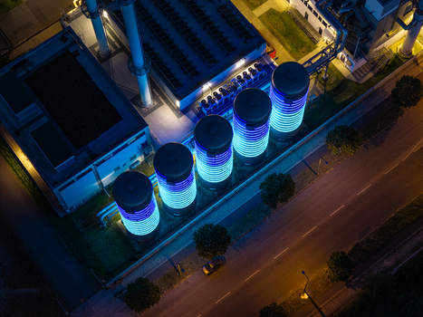 Aerial view of the BTB Heat and Power Plant Adlershof featuring glowing tanks that visualize real time water temperature and heat energy storage in Berlin Berlin Germany. Aerial view of the BTB Heat and Power Plant Adlershof featuring glowing tanks that visualize real time water temperature and heat energy storage in Berlin Berlin Germany.
