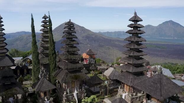 Aerial view of a traditional temple with volcanic mountains Indonesia. Aerial view of a traditional temple with volcanic mountains Indonesia.