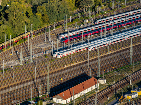 Berlin Berlin Germany 20 September 2026 Aerial view of ICE Werk Berlin Rummelsburg with multiple high speed ICE trains on parallel tracks overhead power lines and a service building. Berlin Berlin Germany 20 September 2026 Aerial view of ICE Werk Berlin Rummelsburg with multiple high speed ICE trains on parallel tracks overhead power lines and a service building.