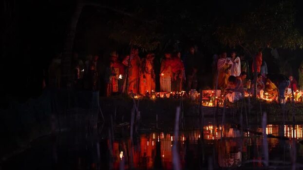 View of people lighting oil lamps at night in Bogura Bangladesh. View of people lighting oil lamps at night in Bogura Bangladesh.