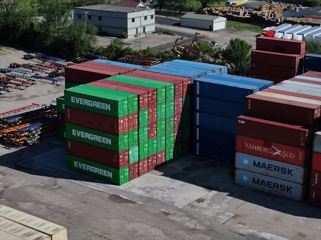 Cincinnati United States 19 April 2026 Aerial view of stacks of colorful shipping containers from Evergreen Maersk and Hamburg Sud in a logistics terminal.
