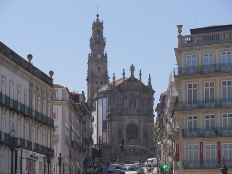 View of Clerigos Church with its iconic bell tower surrounded by historic buildings and city streets in Porto Porto District Portugal. View of Clerigos Church with its iconic bell tower surrounded by historic buildings and city streets in Porto Porto District Portugal.