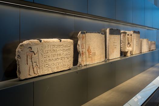 Giza Egypt 16 May 2026 View of ancient Egyptian stone stelae with hieroglyphics and carved figures displayed in the Grand Egyptian Museum.