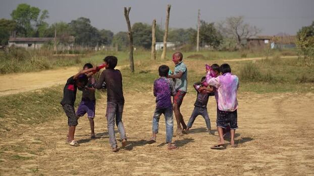 View of children playing with colored powder during Holi Nepal.