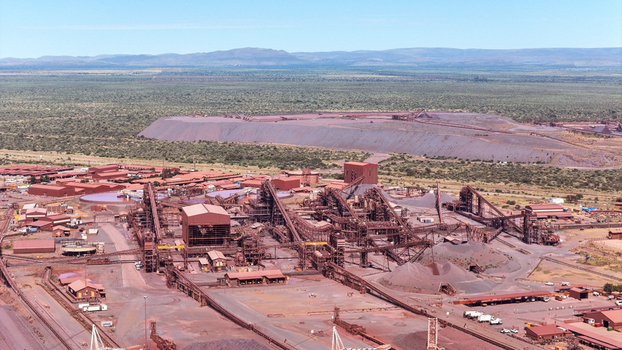 Aerial view of a vast industrial complex stretching across the landscape with reddish brown tones contrasting against the distant green horizon Limpopo South Africa Africa. Aerial view of a vast industrial complex stretching across the landscape with reddish brown tones contrasting against the distant green horizon Limpopo South Africa Africa.