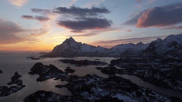 Aerial view of Lofoten mountains at sunset in Norway.