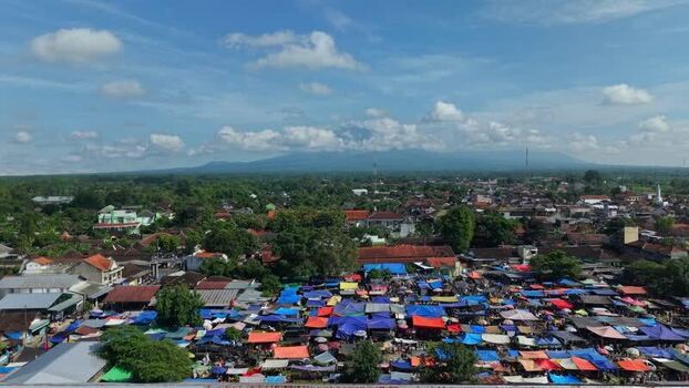 Aerial view of Bonyokan Pasar Legi market and mountain Indonesia.