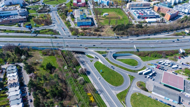 Aerial view of the intertwined roads and highways cutting through a vibrant landscape contrasting urban development with natural green spaces Prague Prague Czechia. Aerial view of the intertwined roads and highways cutting through a vibrant landscape contrasting urban development with natural green spaces Prague Prague Czechia.