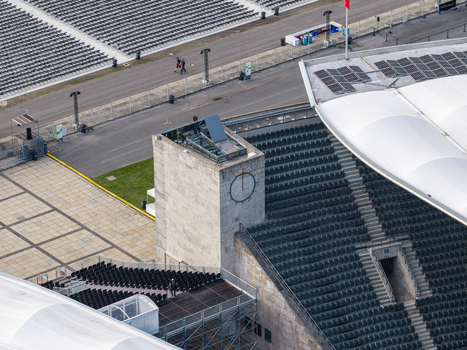 Berlin Germany 26 September 2026 Aerial view of the historic Olympiastadion Berlin showcasing its iconic stone clock tower tiered seating sections and surrounding paved plazas.