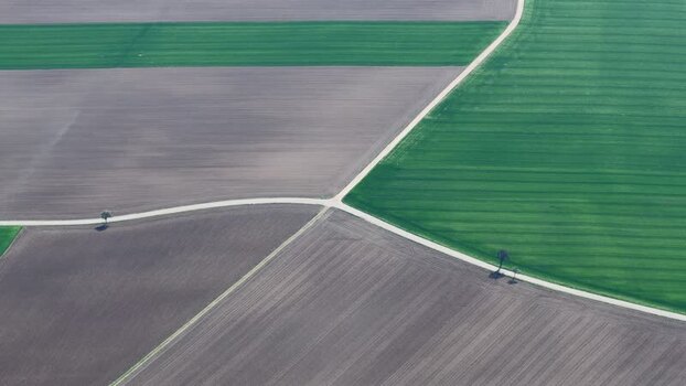 Aerial view of green and brown fields France.