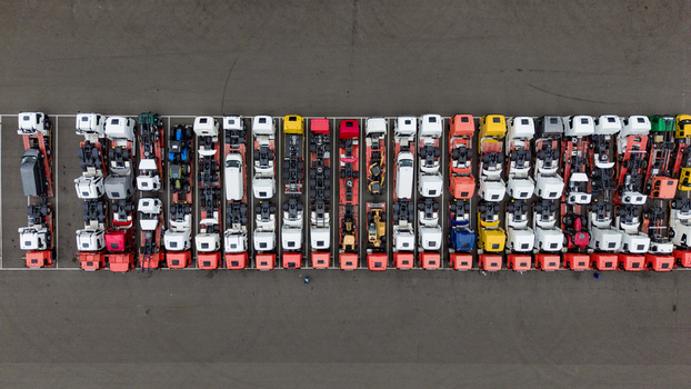 Aerial view of rows of parked semi trucks and trailers in a logistics yard at Ekkersrijt 2037 in Son Noord Brabant Netherlands.