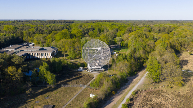 Aerial view of the Radiotelescoop at the Dwingeloo Radio Observatory surrounded by dense green forest and modern research facilities Dwingeloo Drenthe Netherlands.