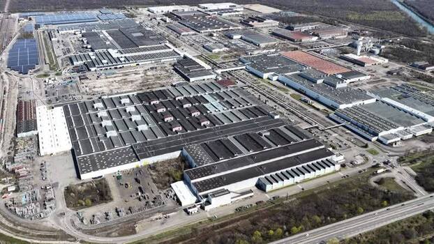 Aerial view of industrial buildings and solar panels France.