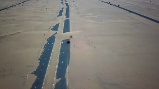 Aerial view of a desert road covered by sand United Arab Emirates.