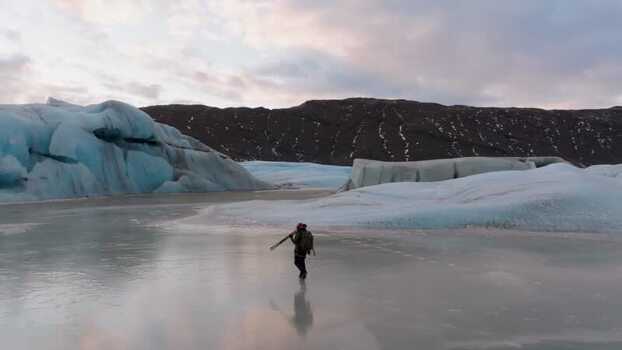 Aerial view of skier on glacial ice in Iceland. Aerial view of skier on glacial ice in Iceland.