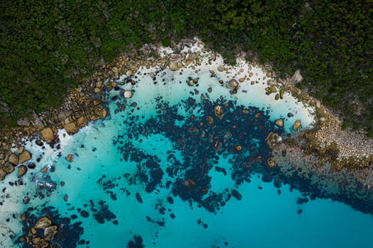 Aerial view of the turquoise waters and rocky shoreline at Bettys Beach Albany WA Australia. Aerial view of the turquoise waters and rocky shoreline at Bettys Beach Albany WA Australia.