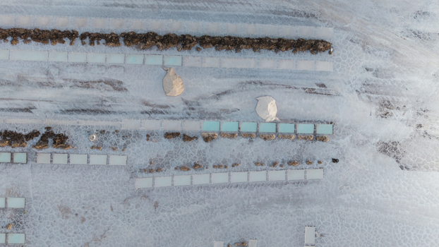 Aerial view of Salinas Grandes salt flats with extraction pools piles of harvested salt and textured white crust in La Poma Department Salta Province Argentina. Aerial view of Salinas Grandes salt flats with extraction pools piles of harvested salt and textured white crust in La Poma Department Salta Province Argentina.