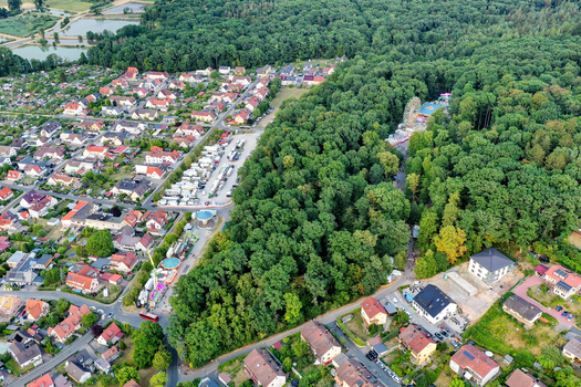 Forchheim Germany 25 July 2025 Aerial view of the Annafest folk festival area nestled in the Kellerwald forest with surrounding residential houses and lush green trees. Forchheim Germany 25 July 2025 Aerial view of the Annafest folk festival area nestled in the Kellerwald forest with surrounding residential houses and lush green trees.