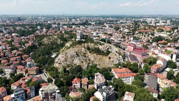 Aerial view of Plovdiv city with rocky hills and rooftops Bulgaria.
