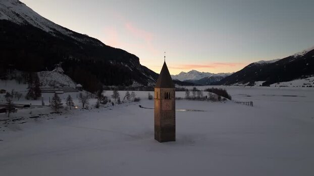 Aerial view of the submerged bell tower in Graun im Vinschgau Italy. Aerial view of the submerged bell tower in Graun im Vinschgau Italy.