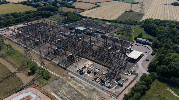 Aerial view of Pelham Substation with electrical infrastructure power lines and surrounding agricultural fields in Bishop s Stortford England United Kingdom. Aerial view of Pelham Substation with electrical infrastructure power lines and surrounding agricultural fields in Bishop s Stortford England United Kingdom.