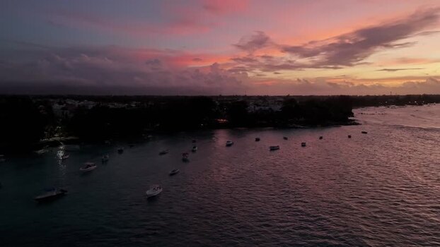 Aerial view of boats in Cap Malheureux bay at sunset Mauritius.