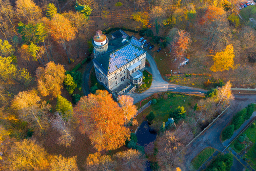 Aerial view of the historic mansion in Zamecky park Vratislavice Nad Nisou surrounded by vibrant autumn foliage and trees under golden hour light in Liberec 30 Liberec Region Czechia. Aerial view of the historic mansion in Zamecky park Vratislavice Nad Nisou surrounded by vibrant autumn foliage and trees under golden hour light in Liberec 30 Liberec Region Czechia.