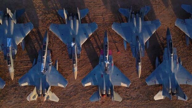 Aerial view of fighter jets parked on land United States. Aerial view of fighter jets parked on land United States.