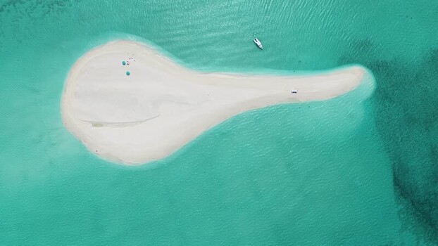 Aerial view of a white sandbank in turquoise waters Maldives. Aerial view of a white sandbank in turquoise waters Maldives.