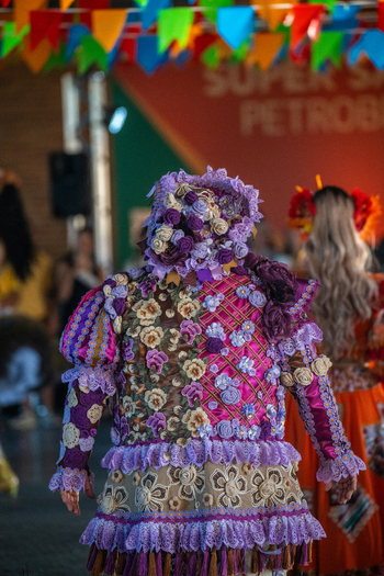 Rio de Janeiro Brazil 20 June 2026 View of a performer in a vibrant floral patterned costume at a Festa Junina celebration with intricate lace details and colorful bunting. Rio de Janeiro Brazil 20 June 2026 View of a performer in a vibrant floral patterned costume at a Festa Junina celebration with intricate lace details and colorful bunting.